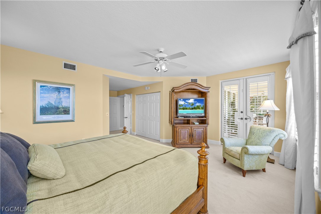 2619 Wulfert Road, Unit 3 Sanibel, FL 33957 - Photo 9 of 42 a bedroom with a bed and a couch