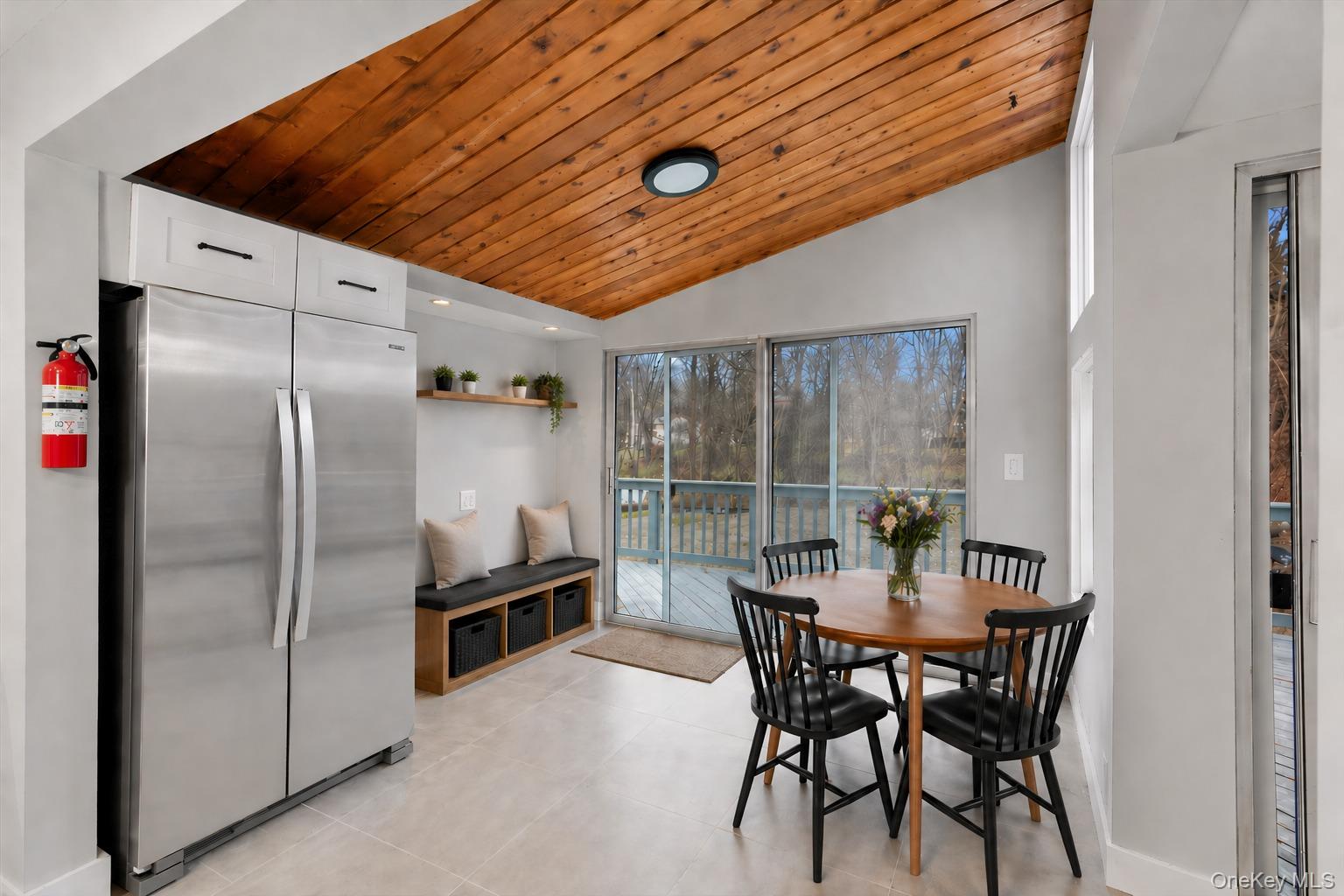 96 Fairmont Road Mahopac, NY 10541 - Photo 9 of 34 Staged breakfast area with sliding glass doors leading from kitchen to the deck and backyard.