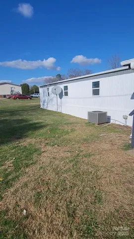 a view of a big house with a big yard
