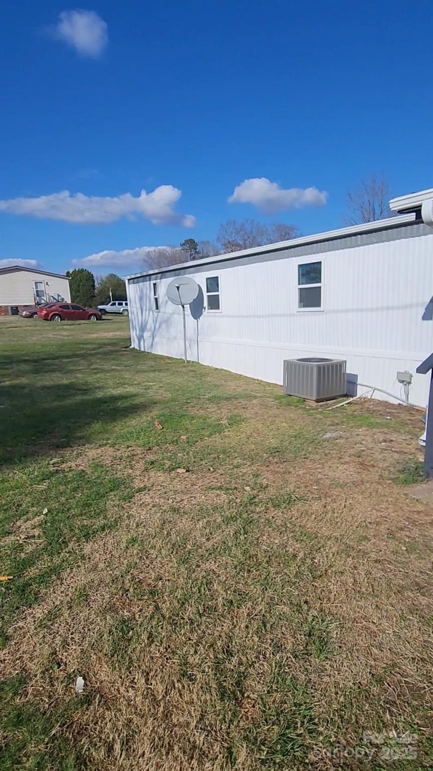440 Ridgeland Drive Cleveland, NC 27013 - Photo 8 of 8 a view of a big house with a big yard