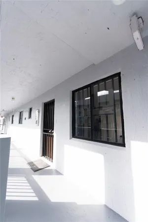 a view of a livingroom and a window