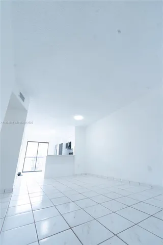 a view of an empty room and window