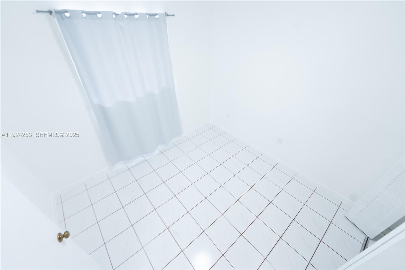 5300 West 21st Court, Unit 311 Hialeah, FL 33016 - Photo 9 of 10 a view of a white wall