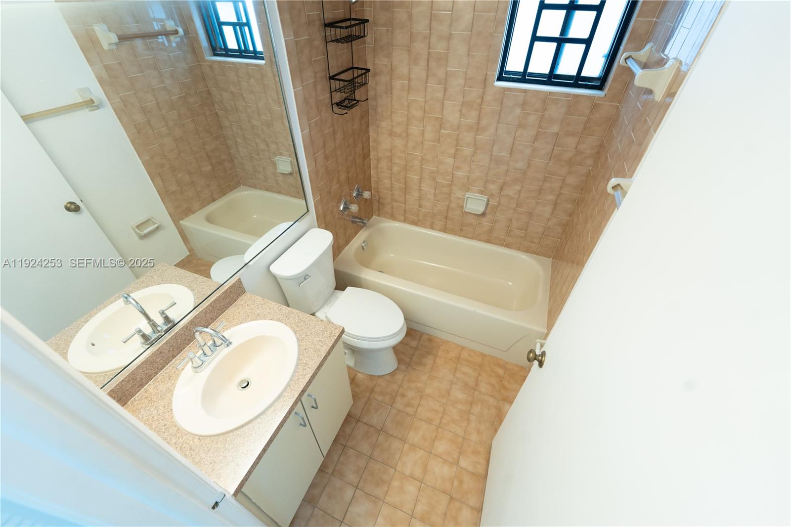 5300 West 21st Court, Unit 311 Hialeah, FL 33016 - Photo 10 of 10 a bathroom with a sink toilet and shower