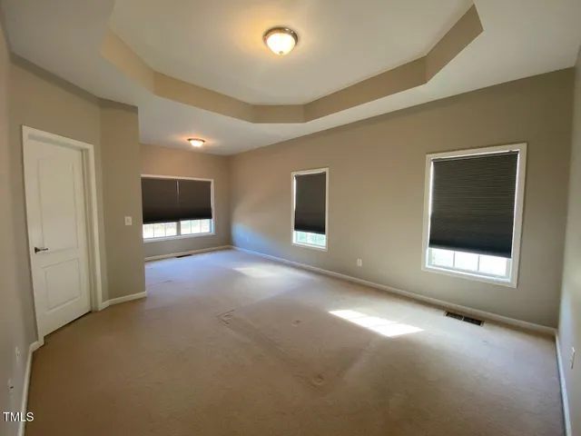 a view of empty room with a flat screen tv