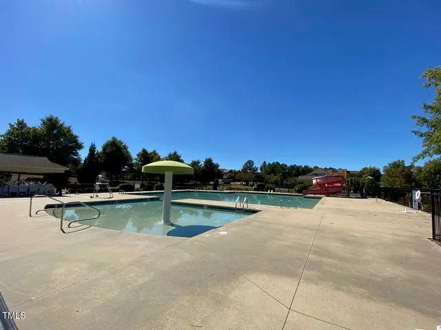 a view of a swimming pool and lounge chair