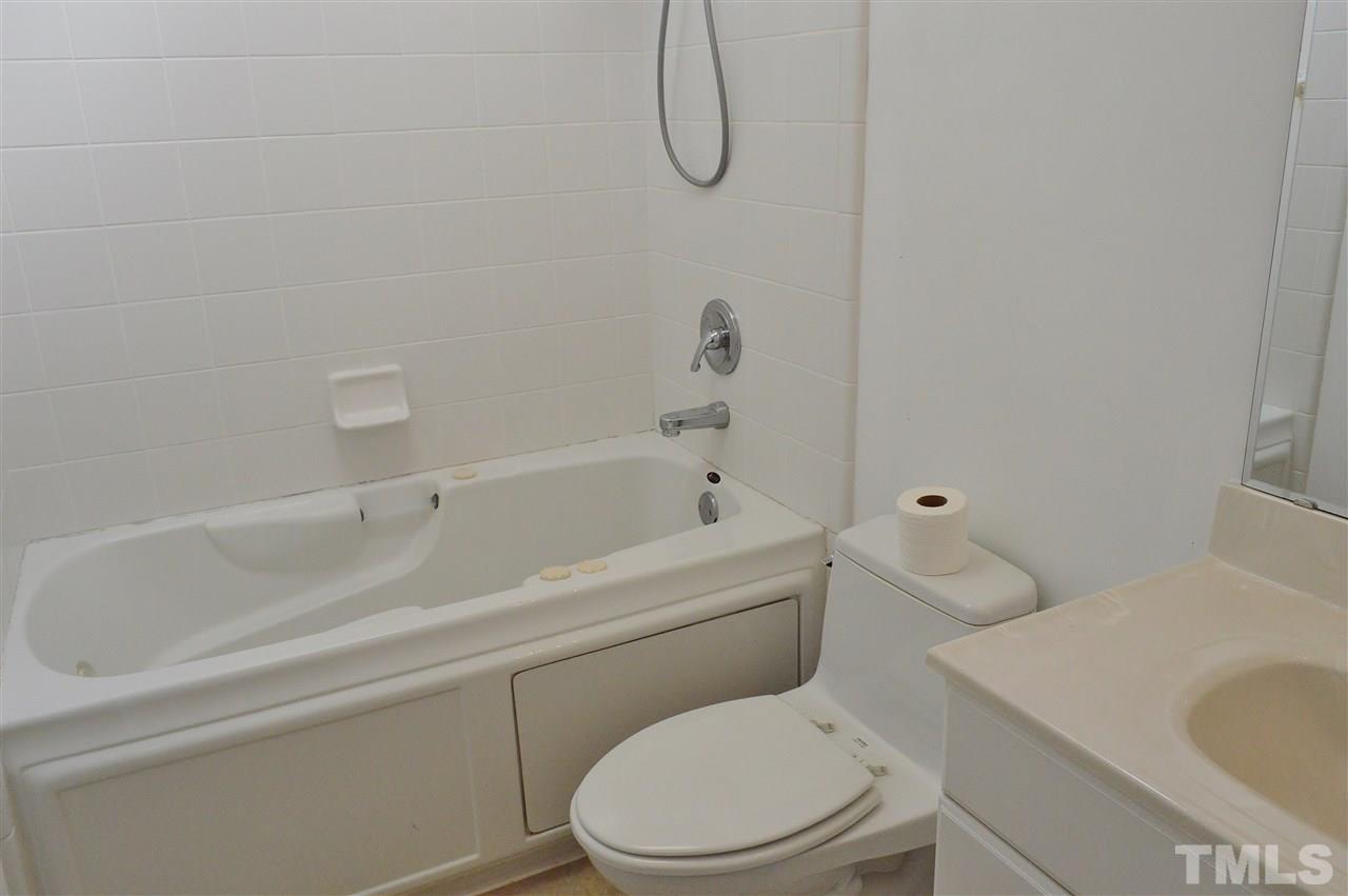 3104 Chancery Place Raleigh, NC 27607 - Photo 15 of 25 The master bath has a whirlpool tub and updated toilet.