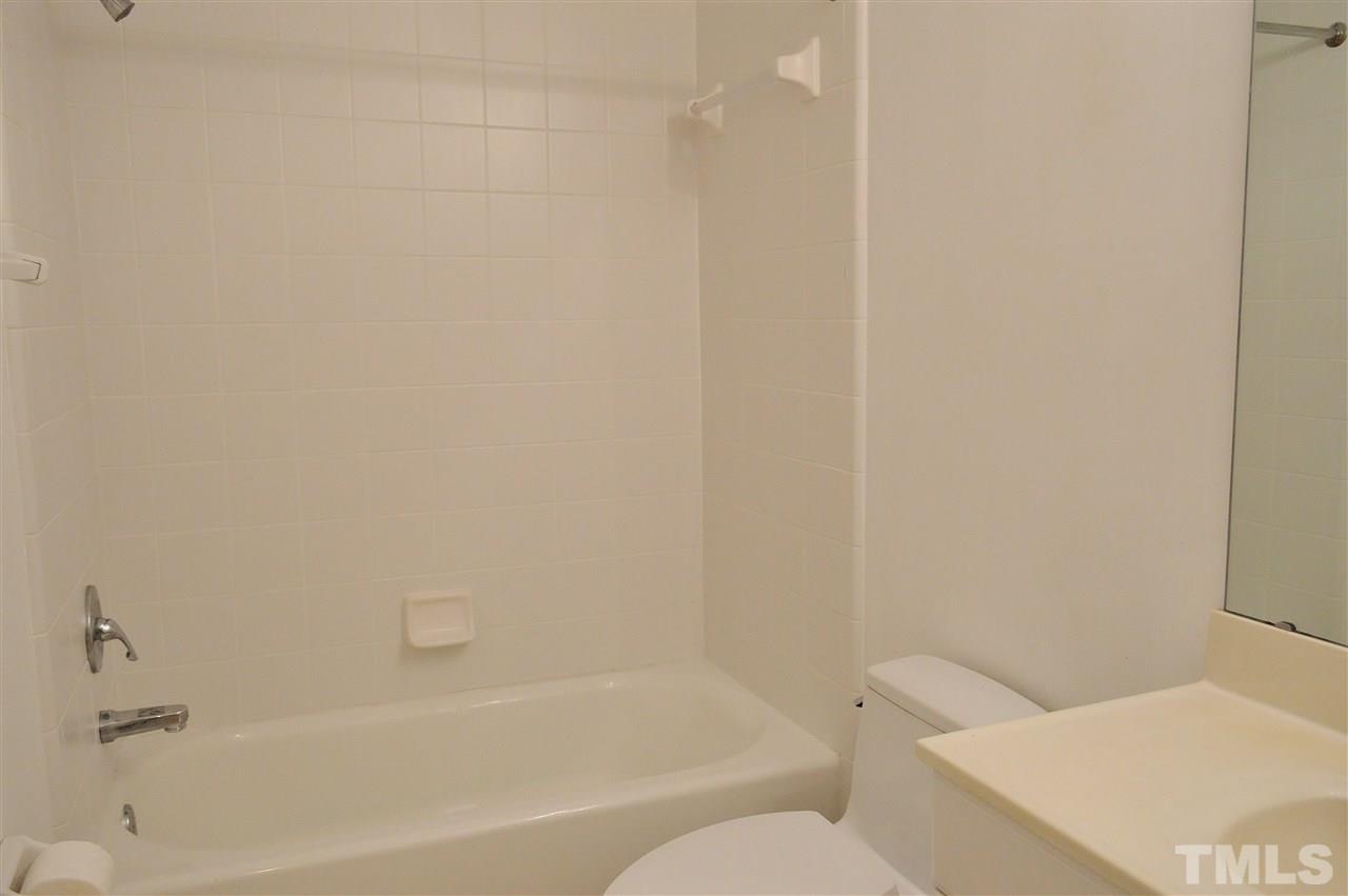 3104 Chancery Place Raleigh, NC 27607 - Photo 19 of 25 The hall bathroom has an updated toilet.