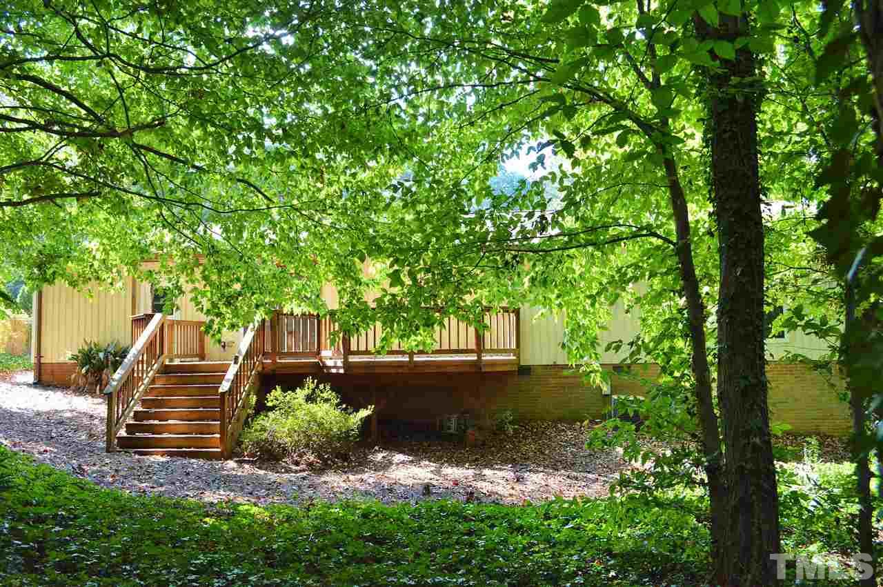 3104 Chancery Place Raleigh, NC 27607 - Photo 22 of 25 The backyard is very wooded and very shady.