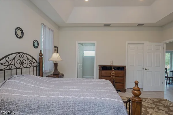 a bedroom with a bed and a dresser