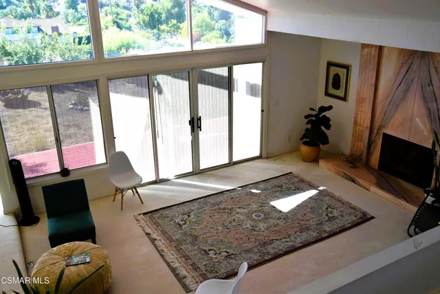 a room with furniture and a flat screen tv