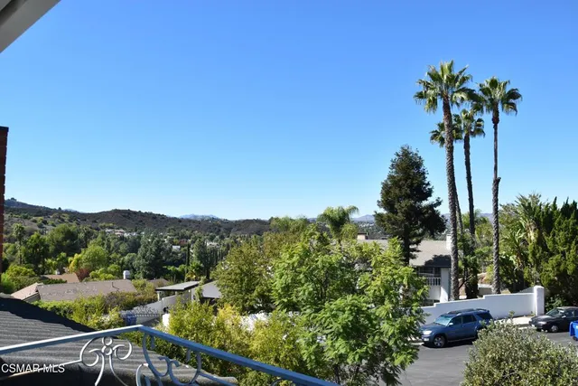 a view of a street with a mountain