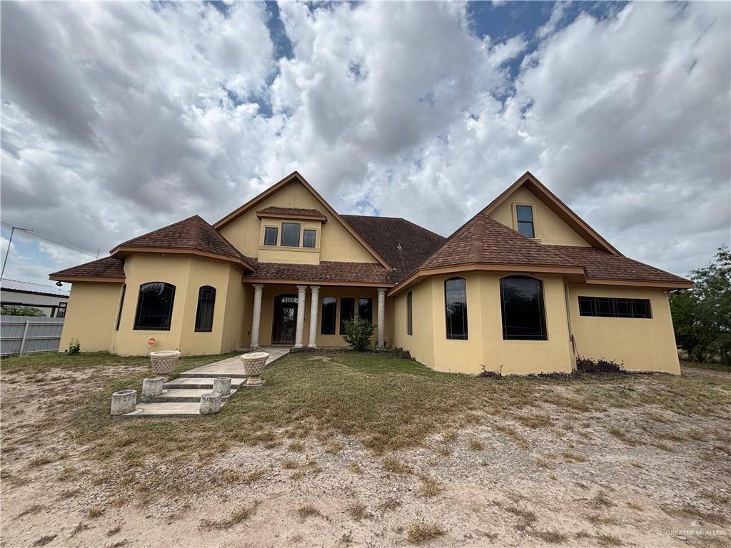 a front view of a house with a yard