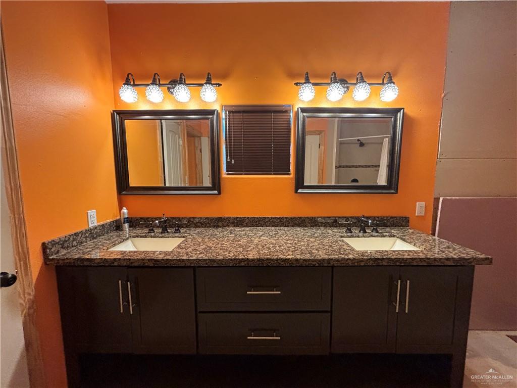 45 Zinnia Street Rio Grande City, TX 78582 - Photo 9 of 31 a bathroom with a sink and a mirror