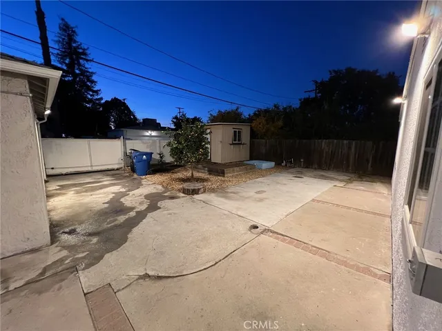 a view of a backyard of the house