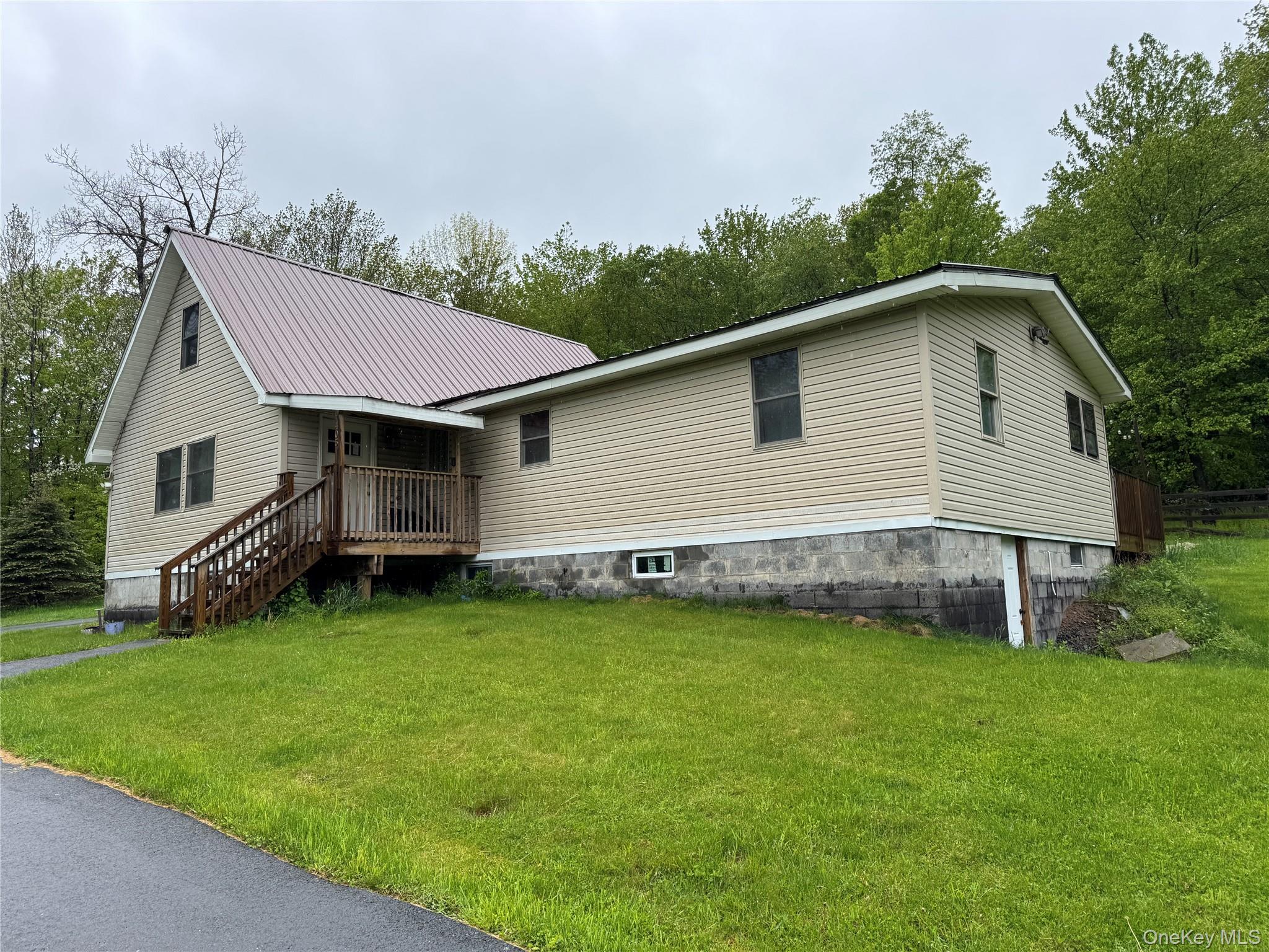 405 Burnt Hill Road Roscoe, NY 12776 - Photo 1 of 11 View of front of home with a front yard, covered porch, and metal roof