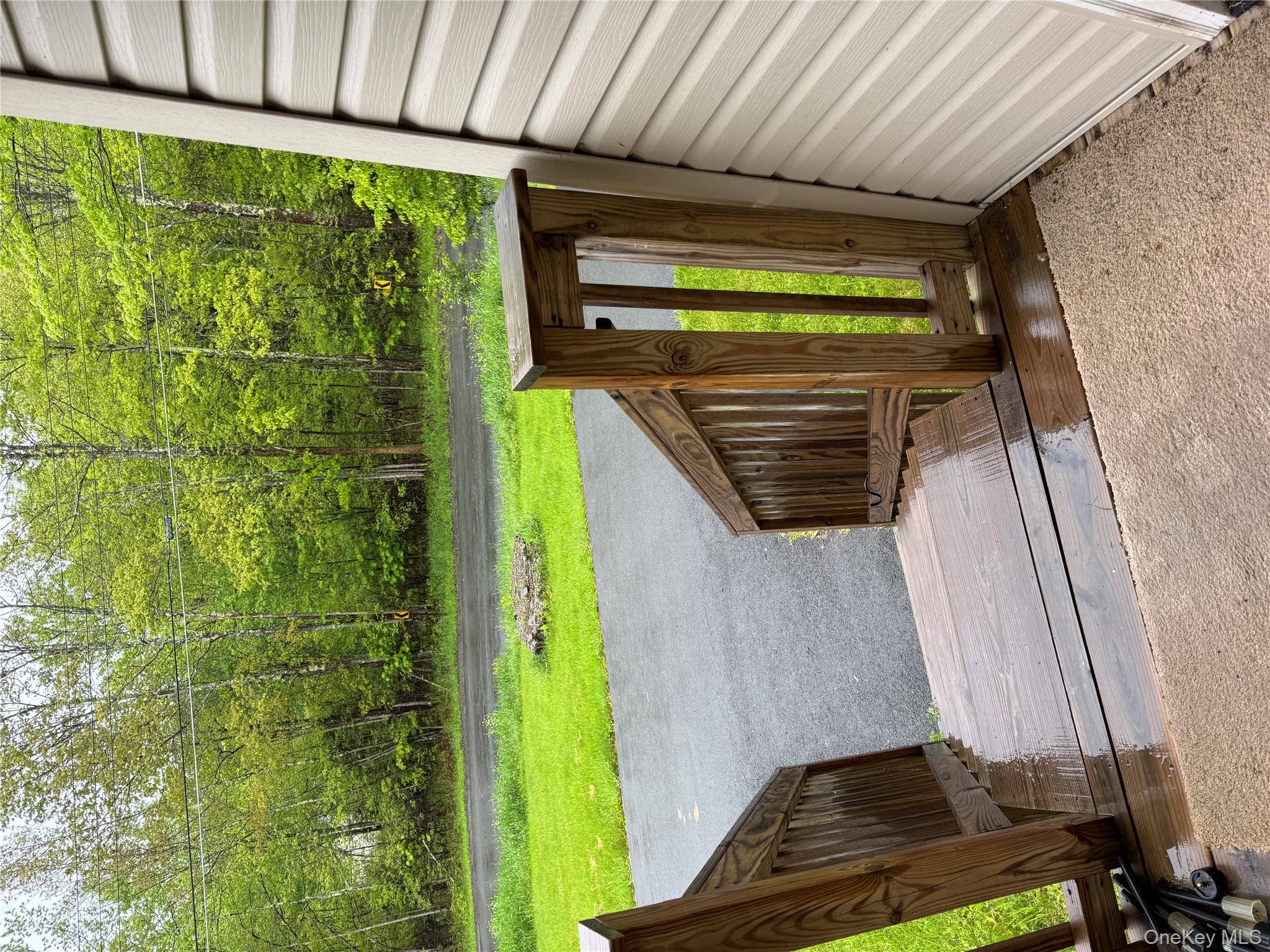 405 Burnt Hill Road Roscoe, NY 12776 - Photo 5 of 11 Wooden terrace with a lawn and a wooded view