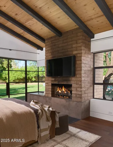 a front view of a house with a yard and potted plants