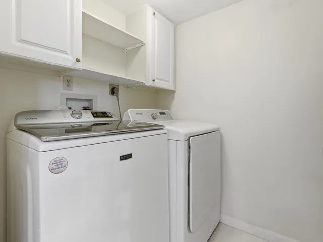 a view of a house with a yard and garden