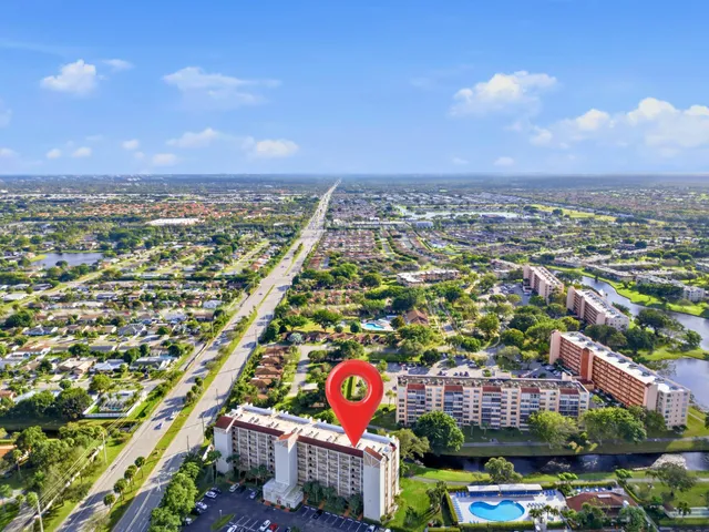 a view of a swimming pool with an outdoor seating