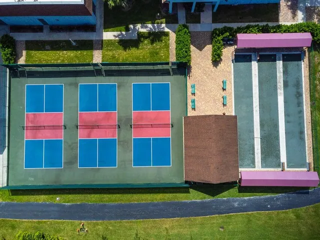 a large kitchen with a table and chairs