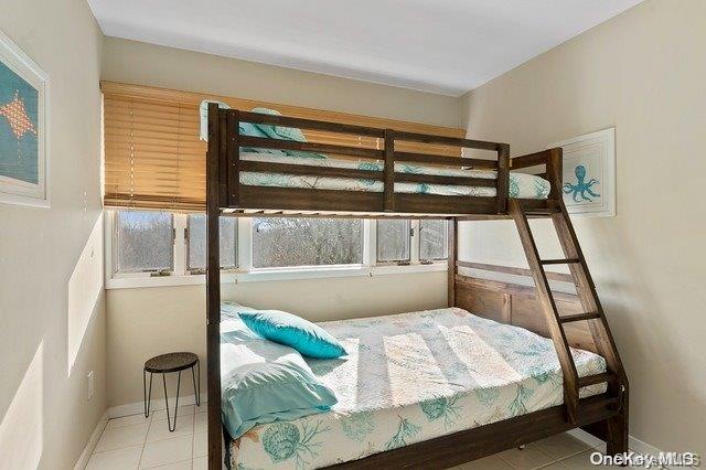 244 Cottage Walk Ocean Beach, NY 11770 - Photo 6 of 11 a living room with furniture and a window