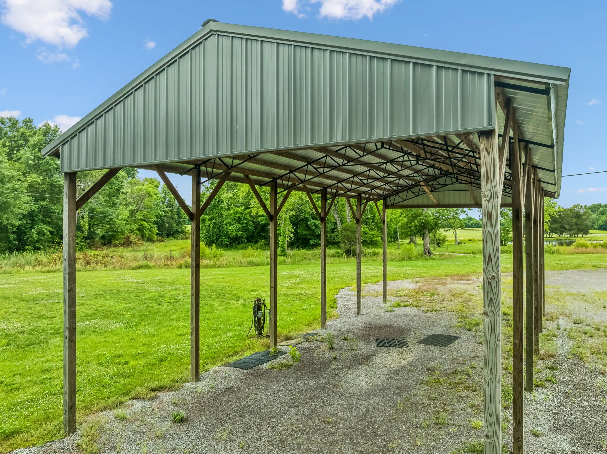 280 Kingdom Road Unionville, TN 37180 - Photo 24 of 65 a blue bench sitting in front of a house