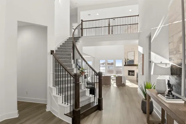 a view of entryway and hall with wooden floor
