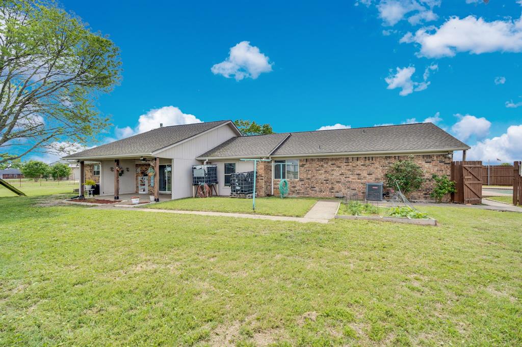 430 Carter Road Italy, TX 76651 - Photo 7 of 36 a front view of house with yard and swimming pool