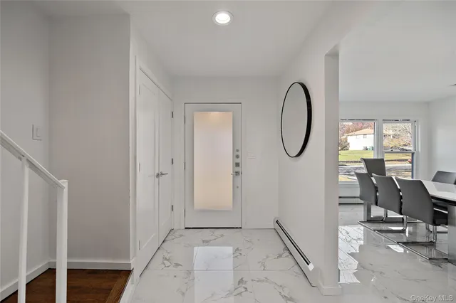a view of a livingroom with furniture and a window