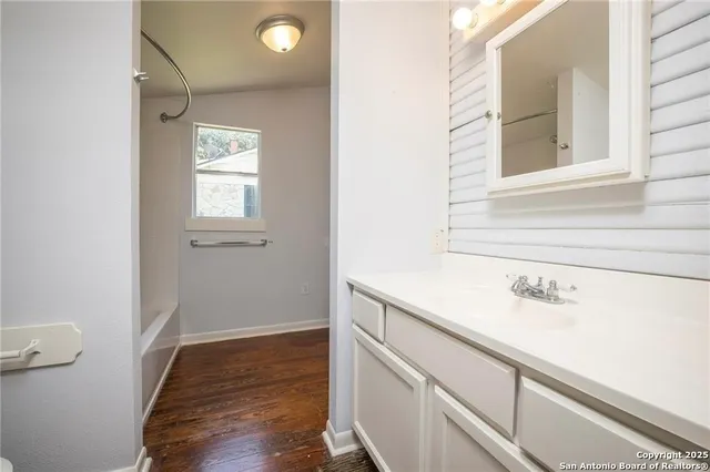 a view of a bathroom with a sink and a window