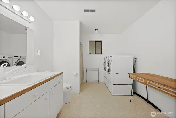 a utility room with dryer and washer