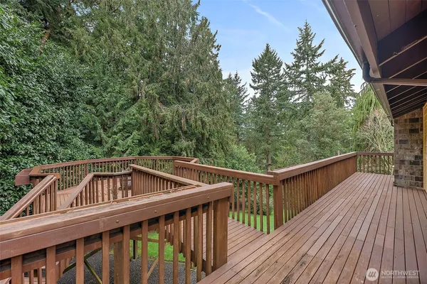 a view of balcony with deck and wooden floor
