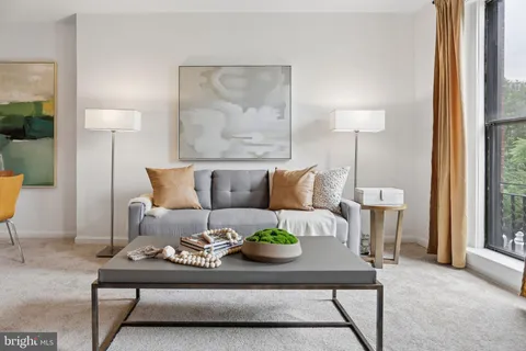 a living room with furniture and a table