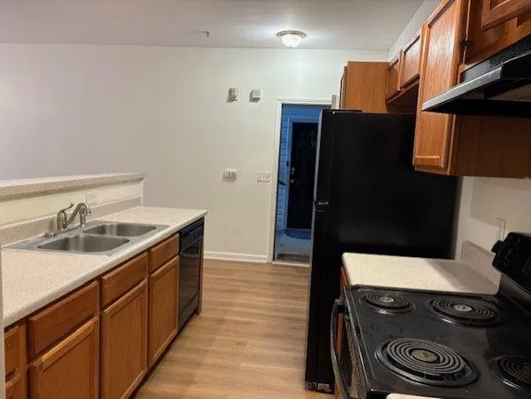 an empty room with a window and wooden floor