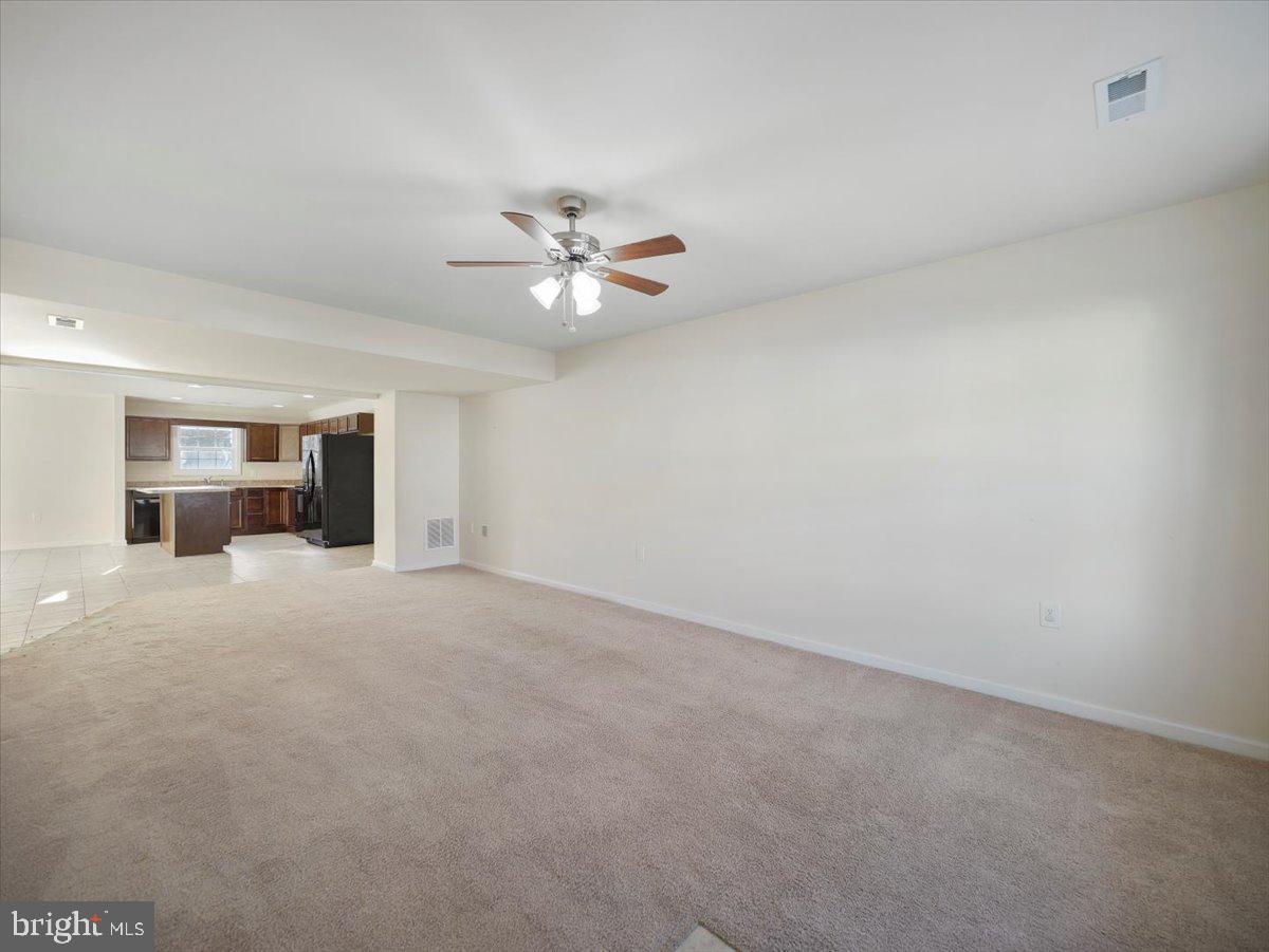 35 Montague Way Inwood, WV 25428 - Photo 15 of 38 an empty room with a ceiling fan and a window
