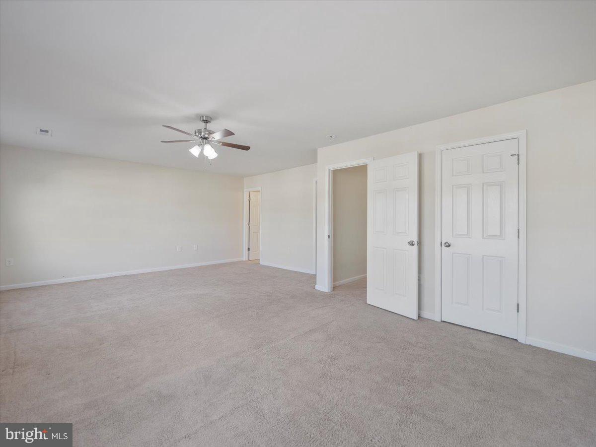 35 Montague Way Inwood, WV 25428 - Photo 28 of 38 a view of an empty room with a ceiling fan