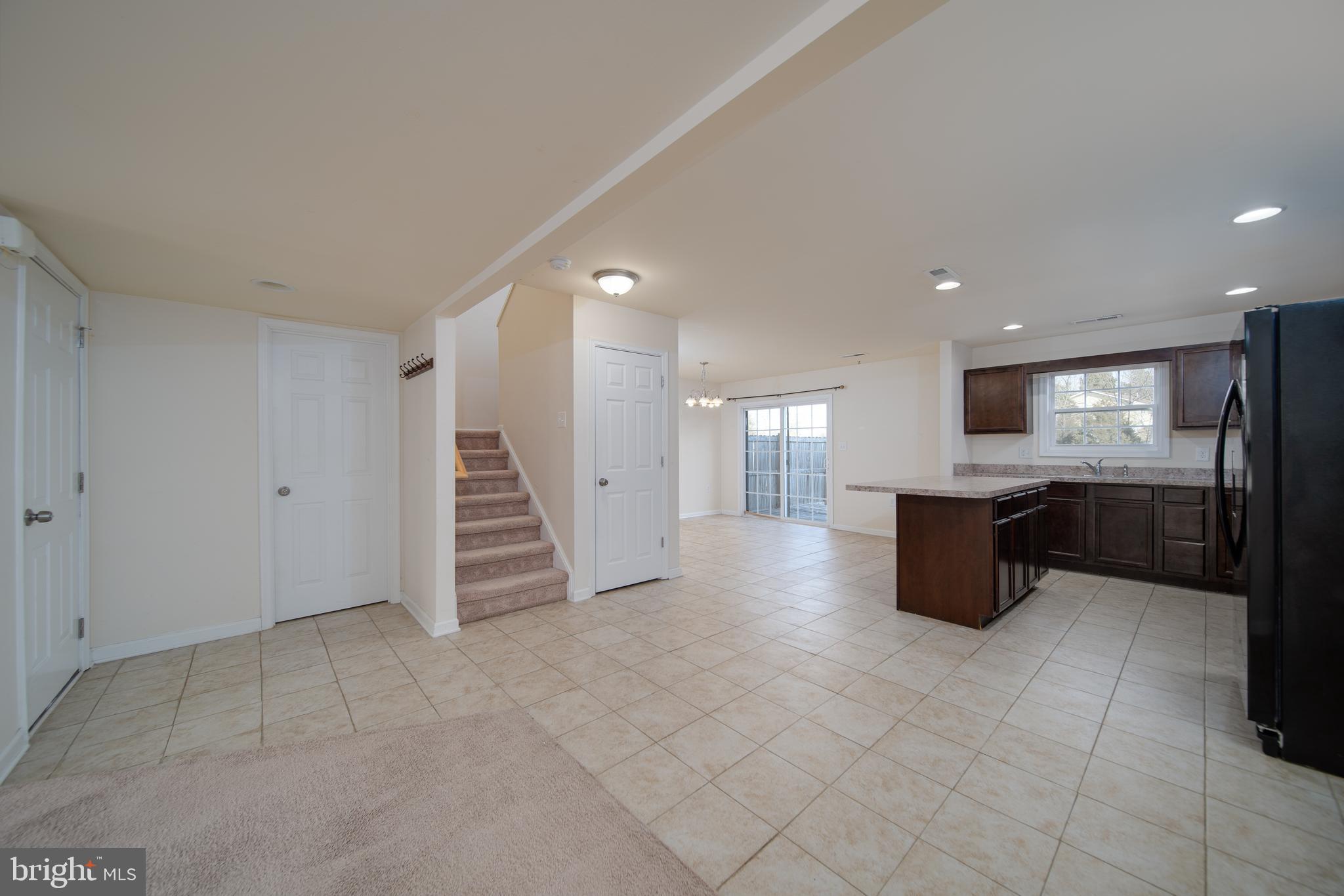 35 Montague Way Inwood, WV 25428 - Photo 3 of 38 a large room with a large window and kitchen view