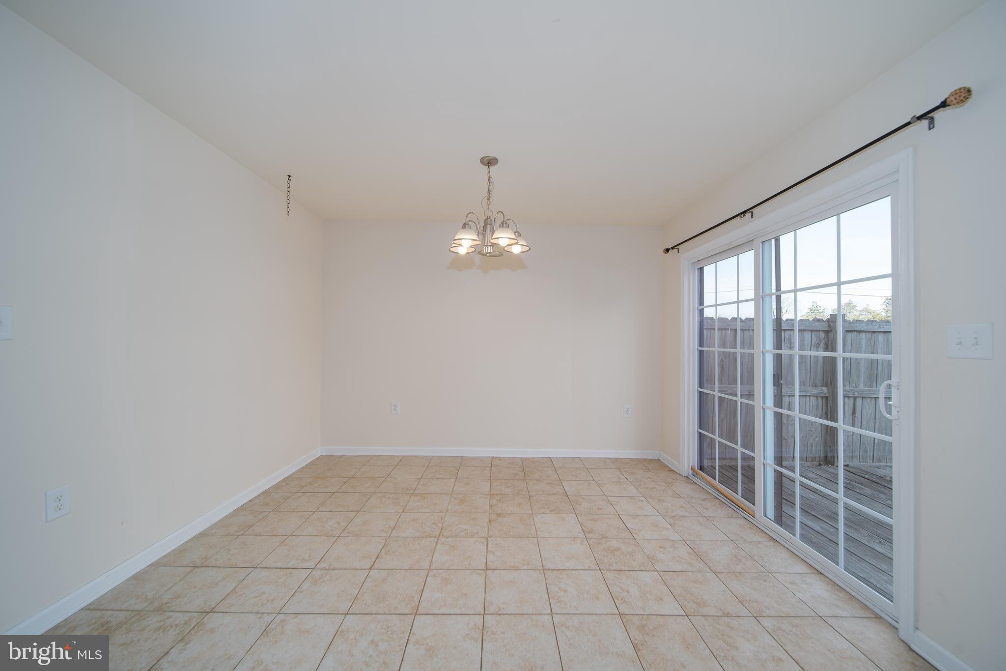 35 Montague Way Inwood, WV 25428 - Photo 5 of 38 wooden floor in an empty room with a window