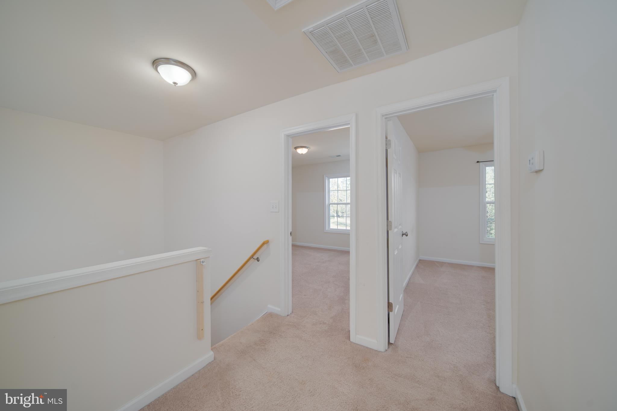 35 Montague Way Inwood, WV 25428 - Photo 6 of 38 wooden floor in an empty room