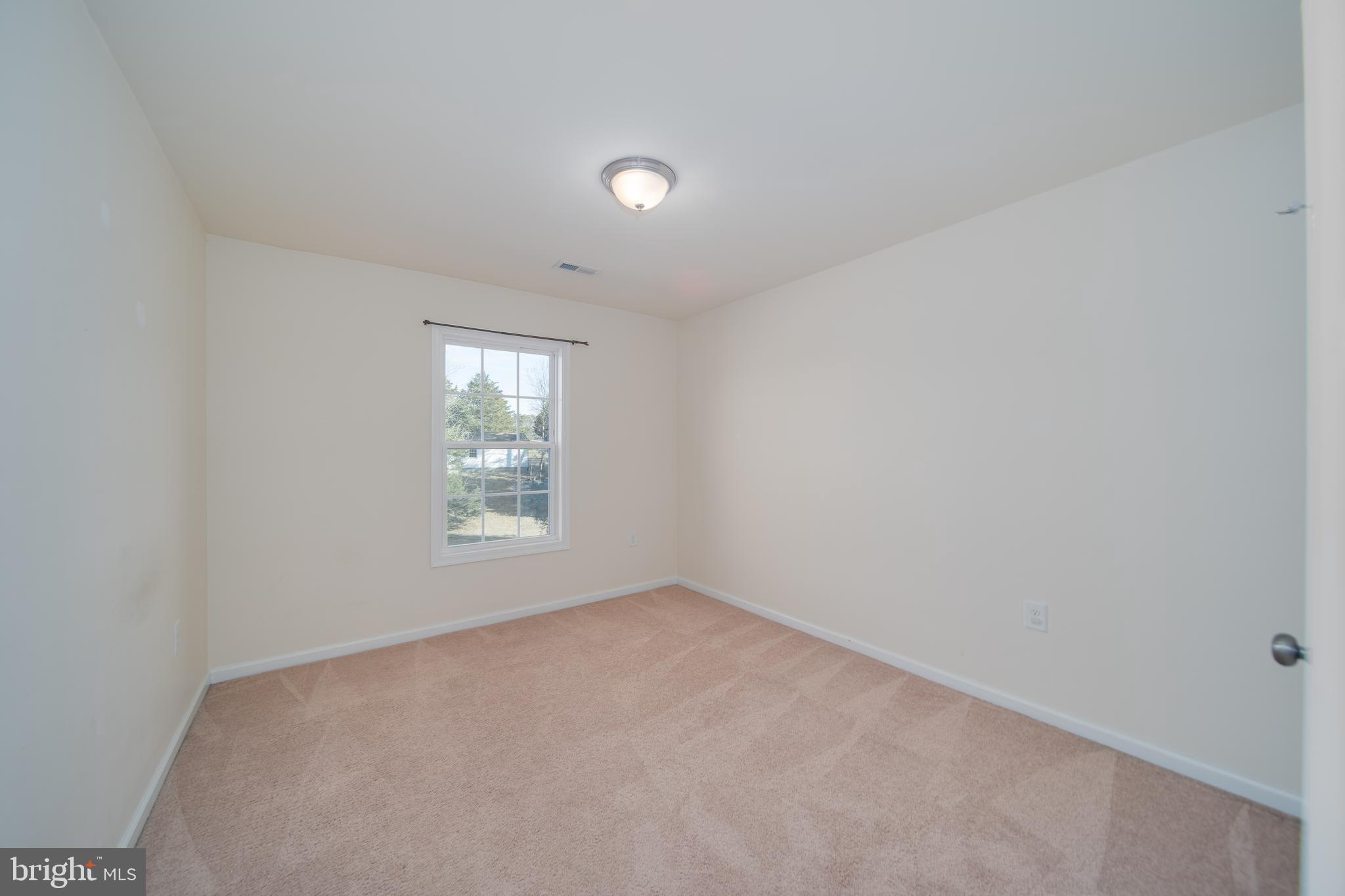35 Montague Way Inwood, WV 25428 - Photo 7 of 38 an empty room with a window