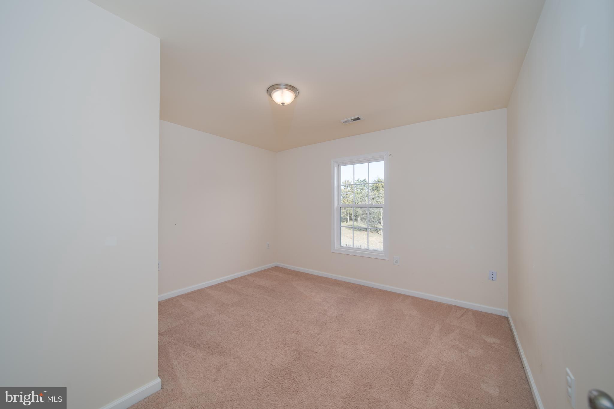 35 Montague Way Inwood, WV 25428 - Photo 9 of 38 a view of an empty room with a window