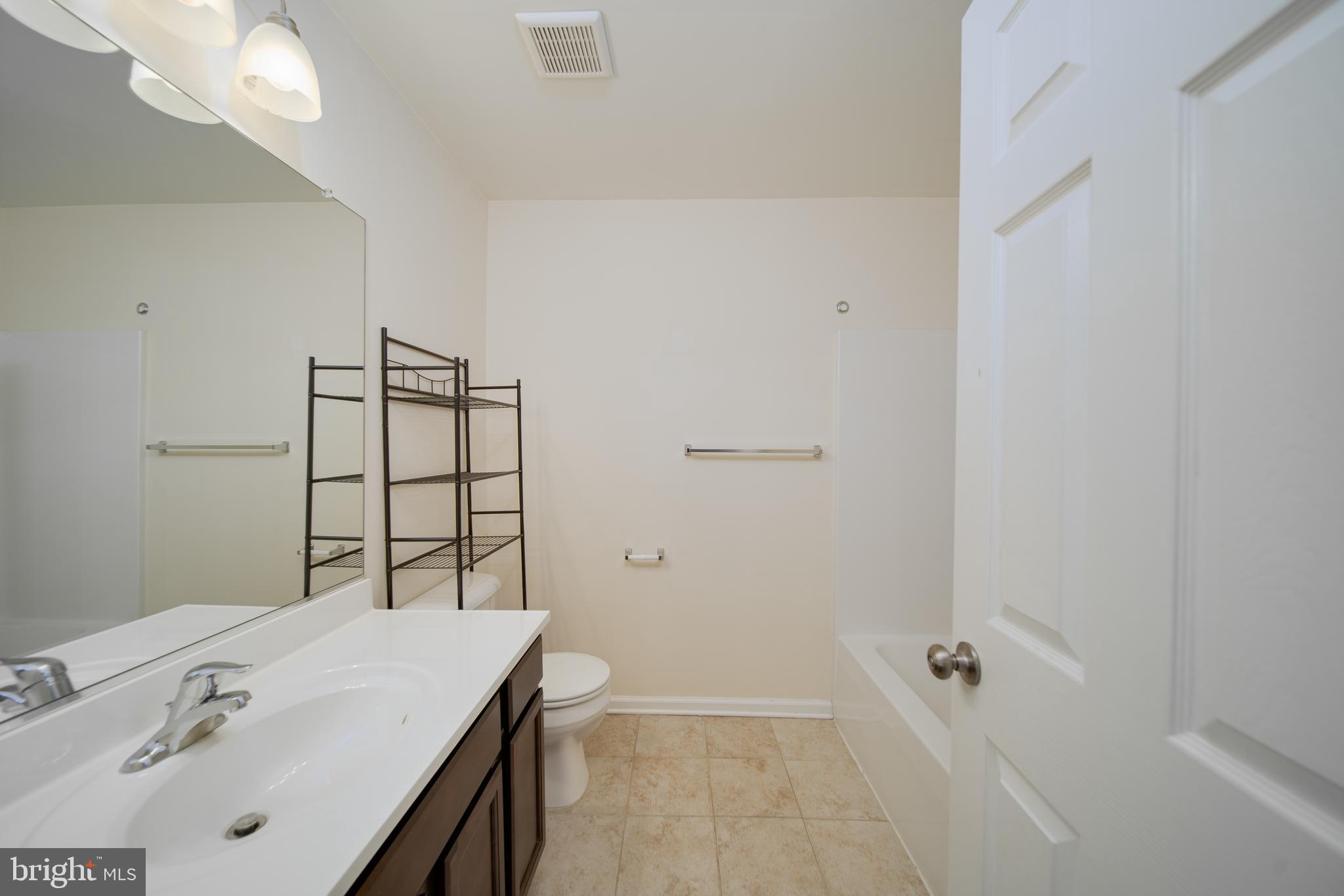 35 Montague Way Inwood, WV 25428 - Photo 10 of 38 a bathroom with a sink and a mirror