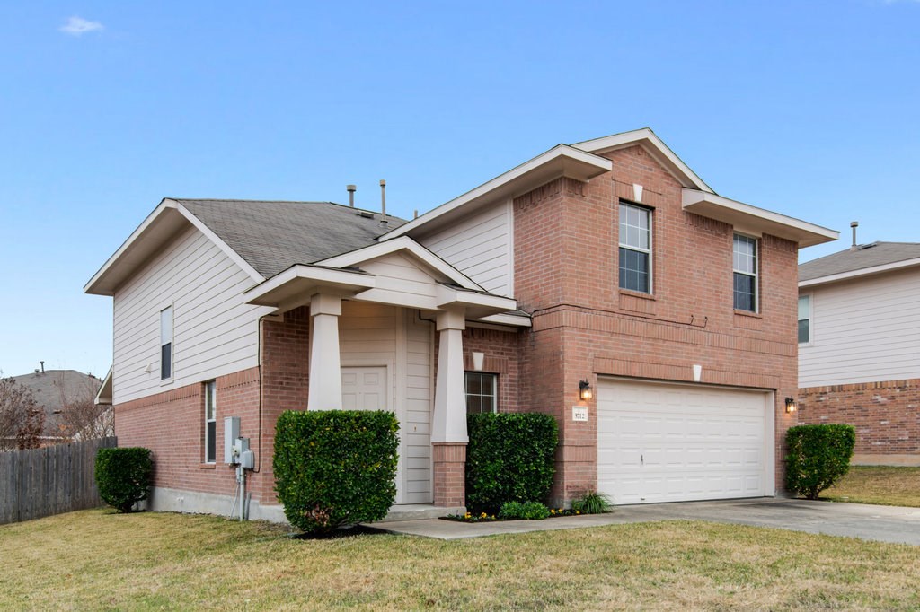 3712 Hawk View Street Round Rock, TX 78665 - Photo 1 of 1 a front view of a house with a yard