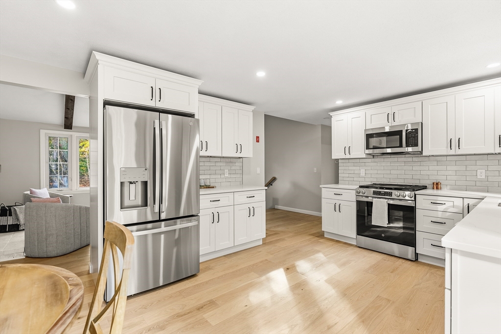 293 Mendall Road Acushnet, MA 02743 - Photo 12 of 41 a kitchen with stainless steel appliances a refrigerator stove microwave and sink