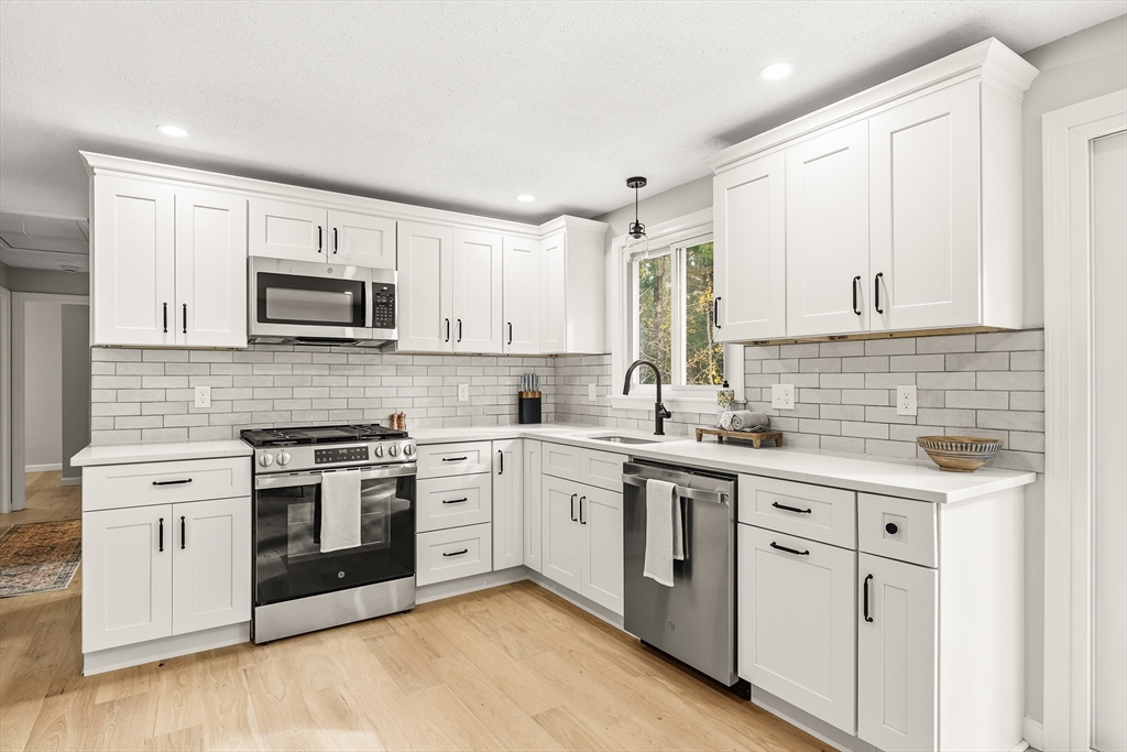 293 Mendall Road Acushnet, MA 02743 - Photo 13 of 41 a kitchen with cabinets stainless steel appliances and sink