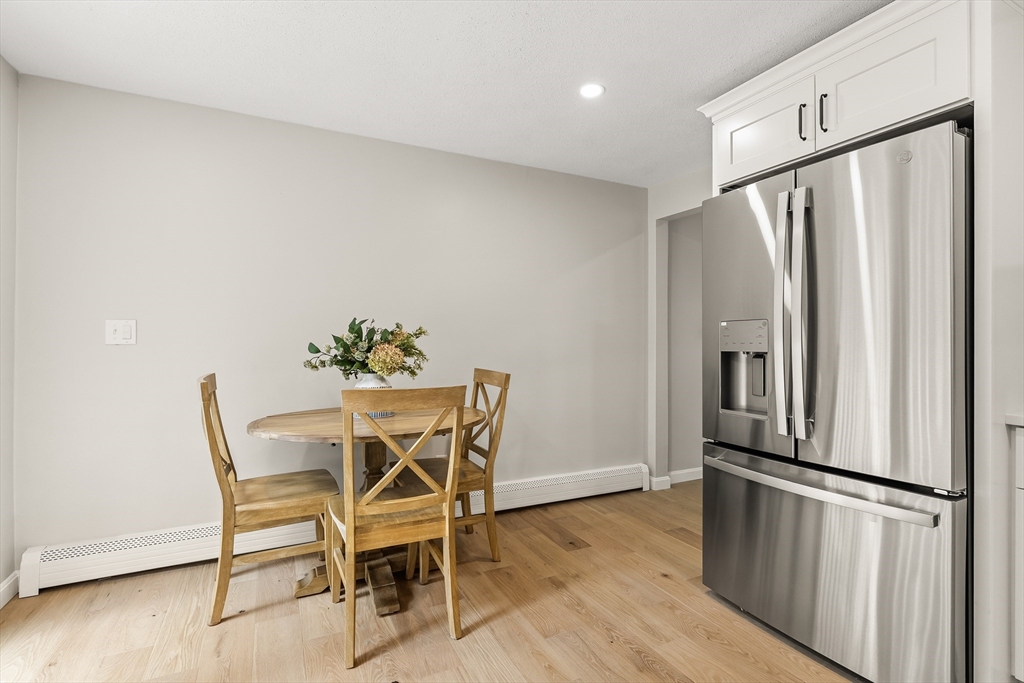 293 Mendall Road Acushnet, MA 02743 - Photo 14 of 41 a kitchen with stainless steel appliances a refrigerator a table and chairs
