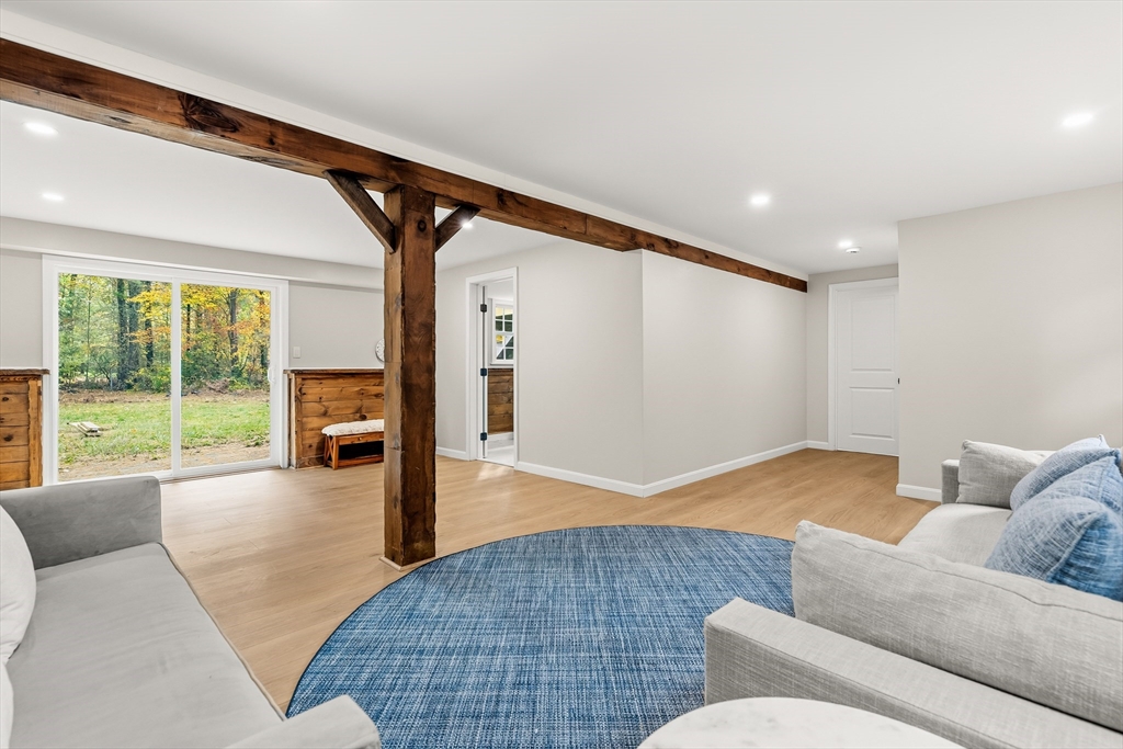 293 Mendall Road Acushnet, MA 02743 - Photo 27 of 41 a living room with furniture and a large window