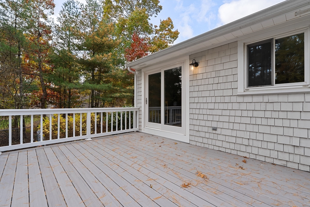 293 Mendall Road Acushnet, MA 02743 - Photo 37 of 41 a view of backyard with deck and wooden floor