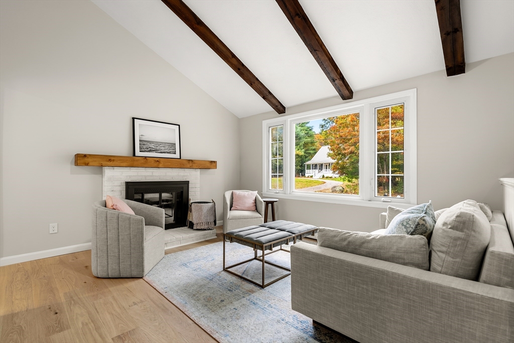 293 Mendall Road Acushnet, MA 02743 - Photo 4 of 41 a living room with furniture and a fireplace